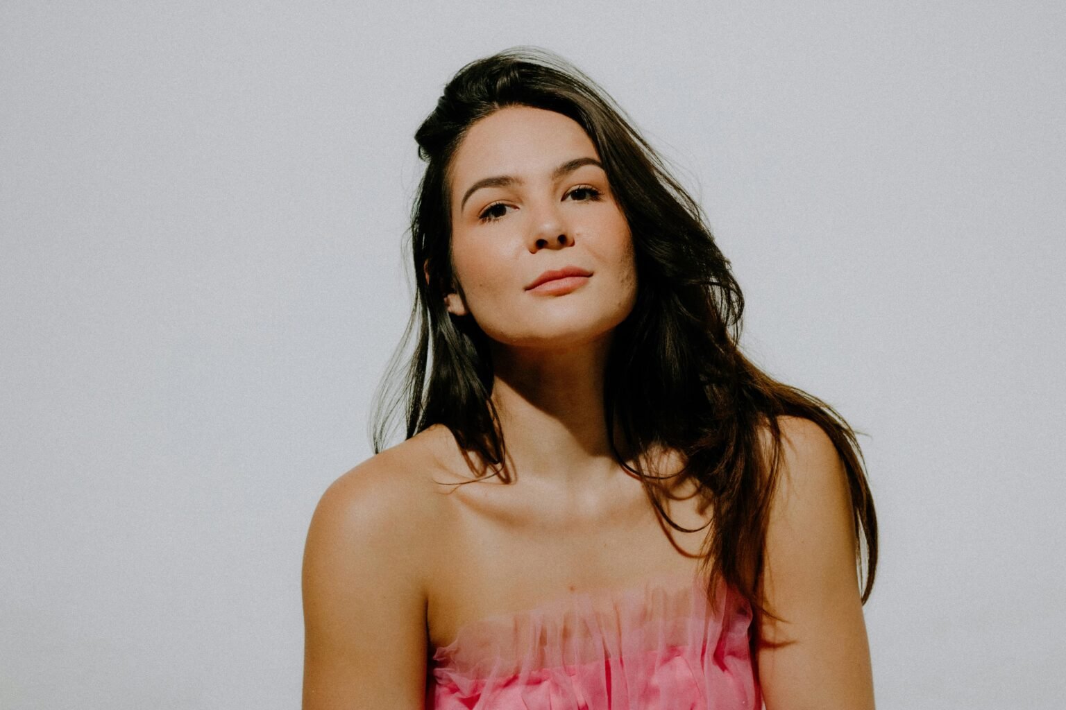 Portrait of Brunette Woman Wearing Pink Dress